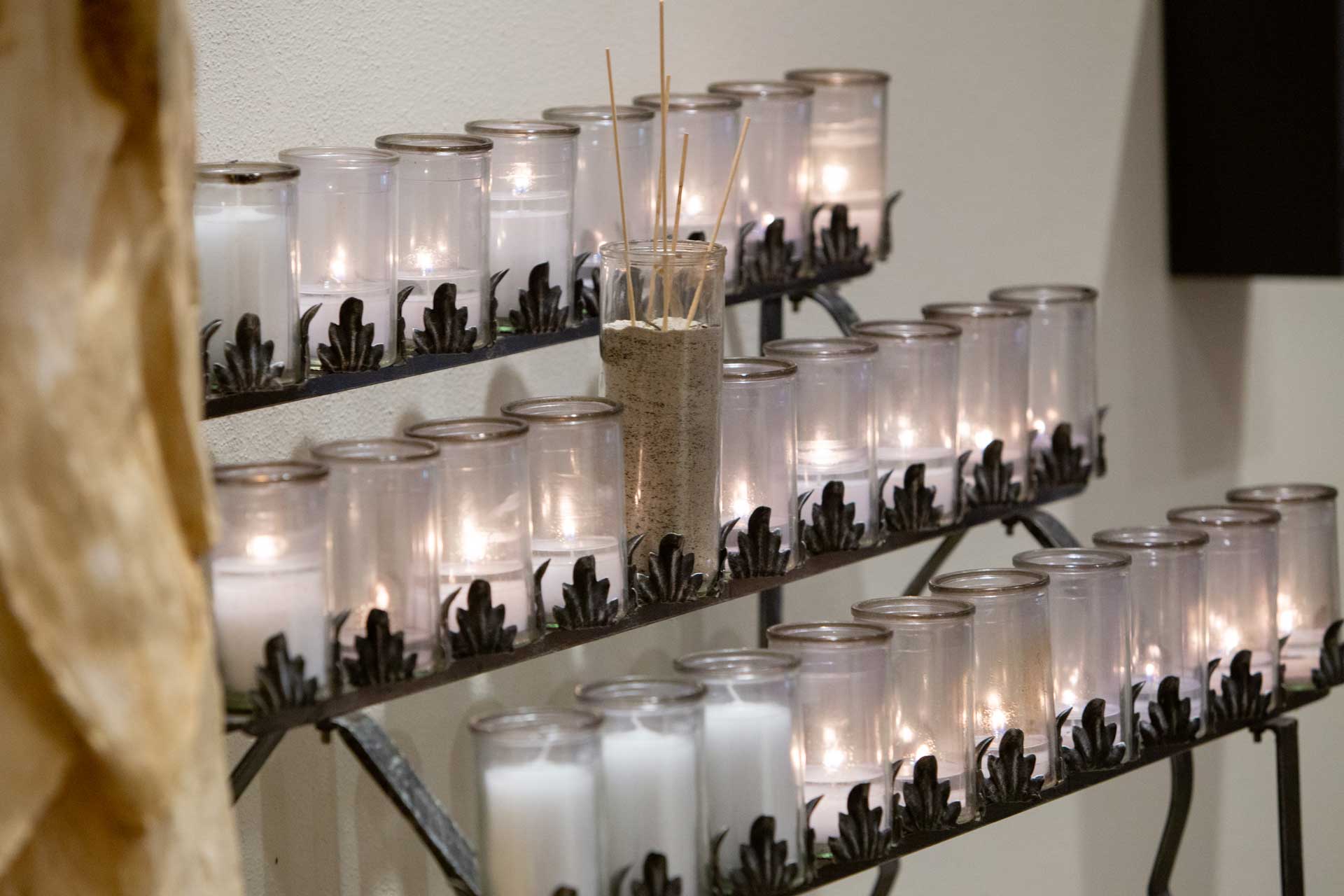 Display with lit candles and incense.