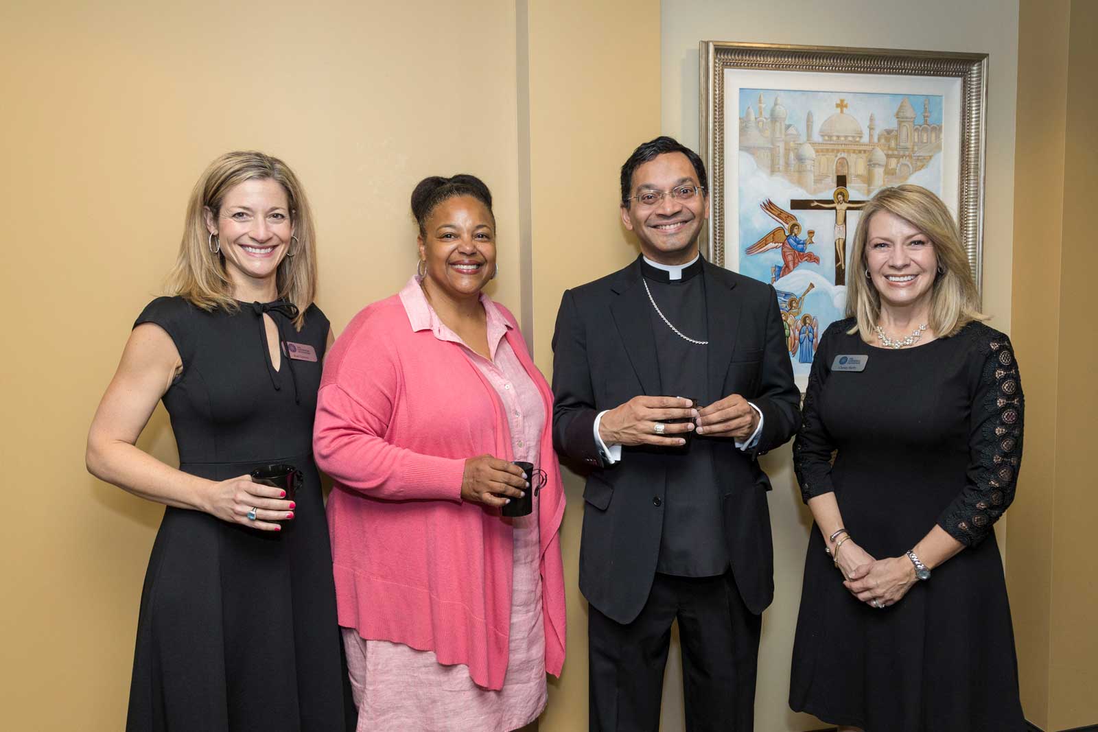 Four of The Catholic Foundation team members posing for a photo.